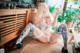 A woman sitting on the floor holding a toy.